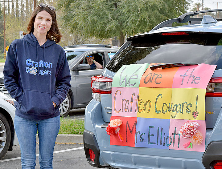 Teacher and her sign.